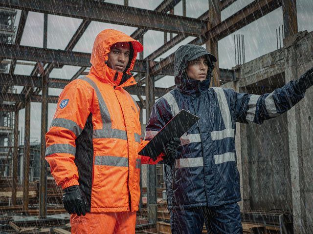 Construction crew working through extreme weather on site