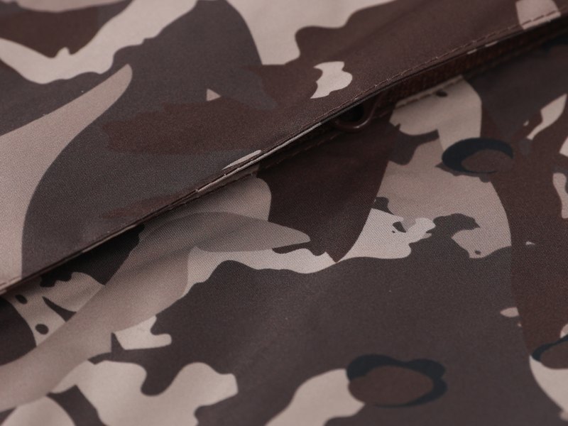 Soft brushed camouflage shell fabric with a quiet, low-rustle face