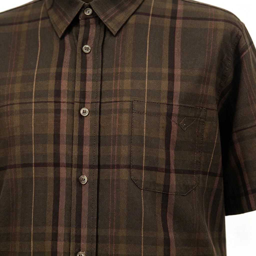 Brown check shirt chest pocket with leather badge detail