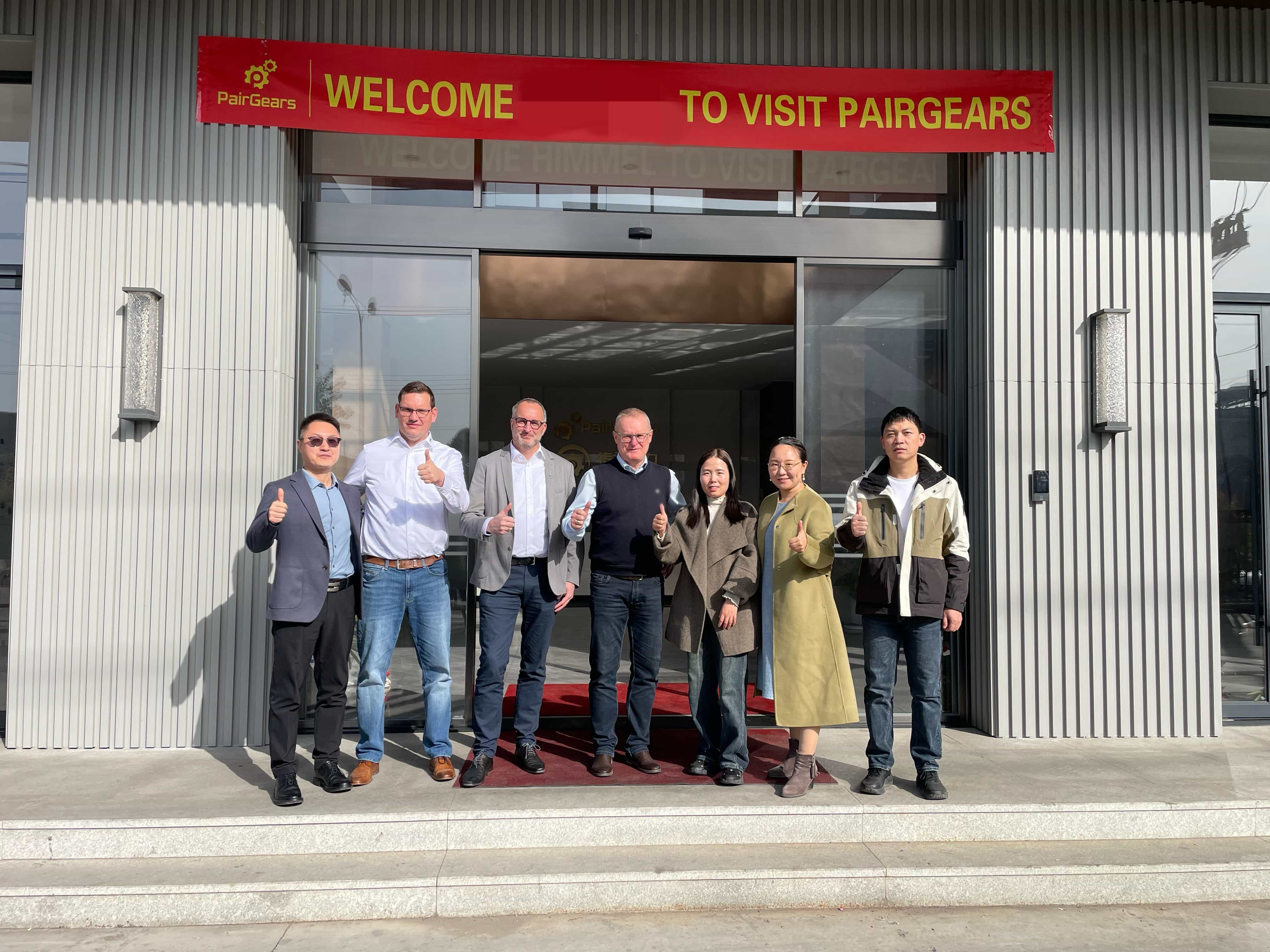 Group photo at the factory entrance