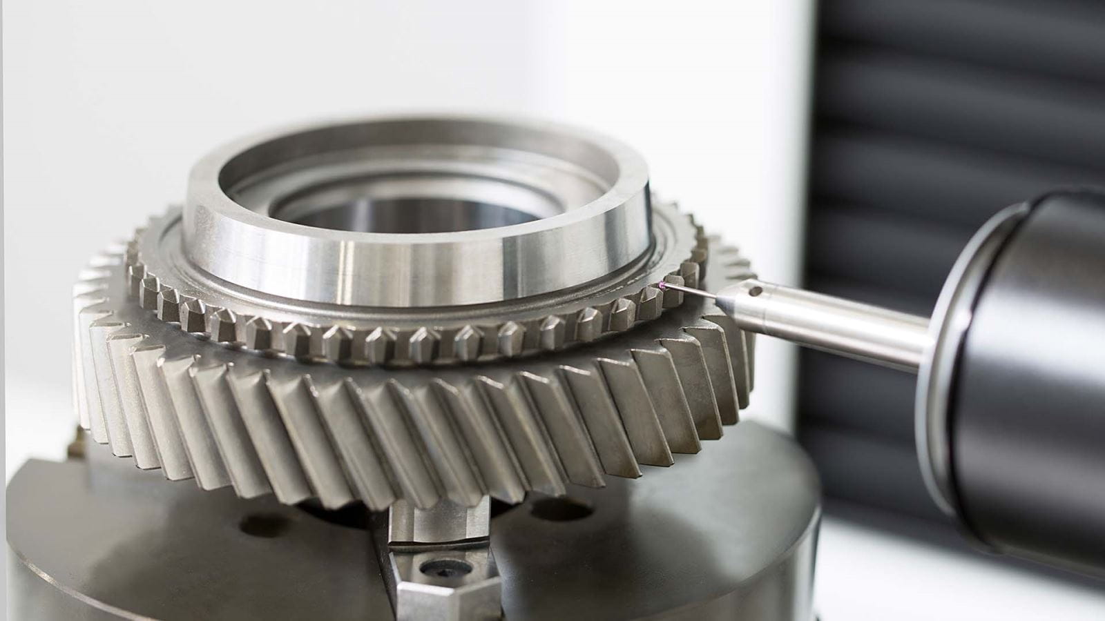 Finished helical gear on an inspection fixture before packing release