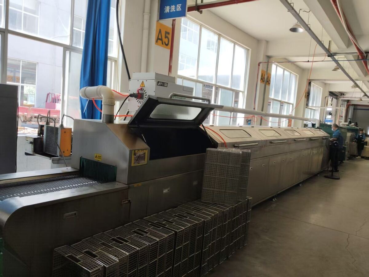 PairGears ultrasonic cleaning line for removing residue from machined gears