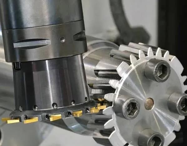 Milling cutter machining a gear blank