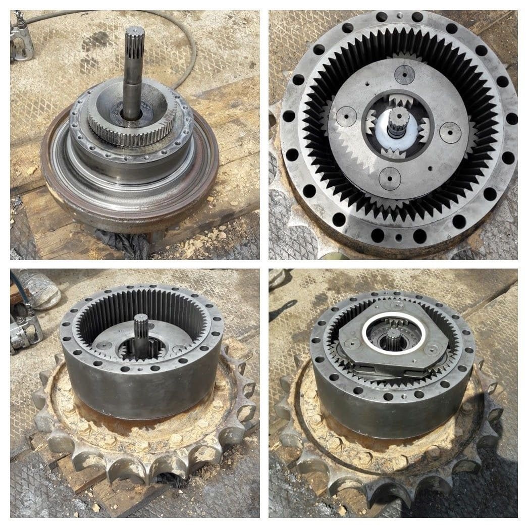 Disassembled excavator planetary final drive with sun, planet and ring gears