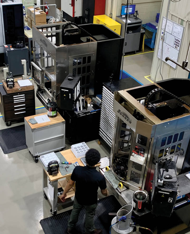 Gear-finishing machines on a shop floor.