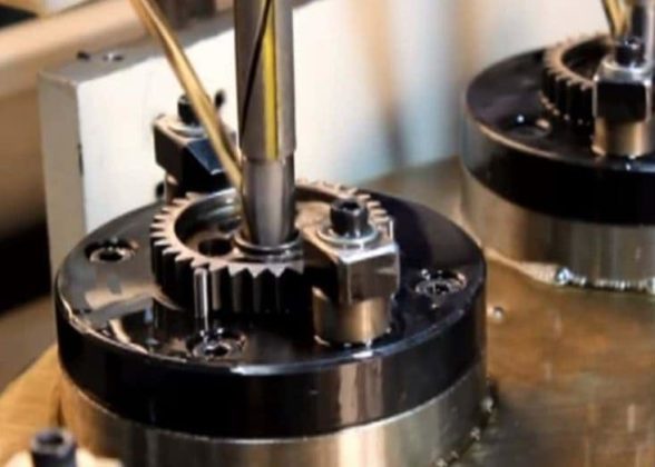 A honing tool operating on a gear.