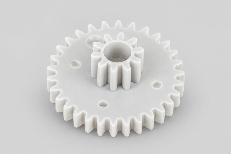 Custom plastic compound gears with multiple gear stages