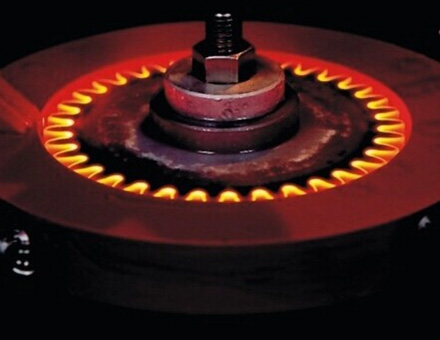 A gear being heated locally during induction hardening