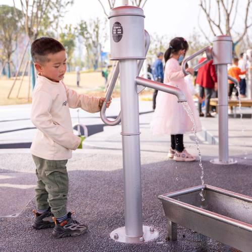 Playground pumps for water play equipment