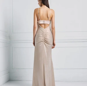 Stunning Custom made Draped Metallic for Ladies featuring alluring back ruche and cut out dress.