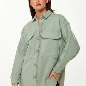 Sample Sport  Eton Neckline  Long Sleeve Solid Color Rectangular Chest Pockets Casual  Tops
