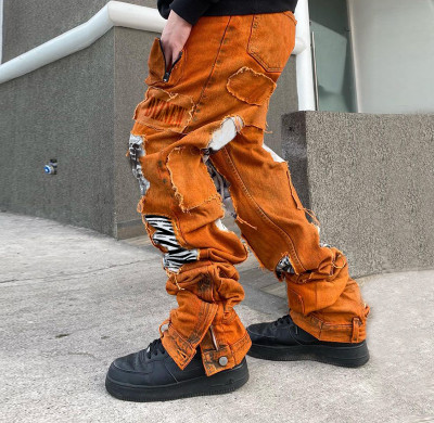 Patchwork-Jeans in Orange mit verwaschenem Stacked-Muster im Großhandel – führender Denim-Hersteller | DiZNEW