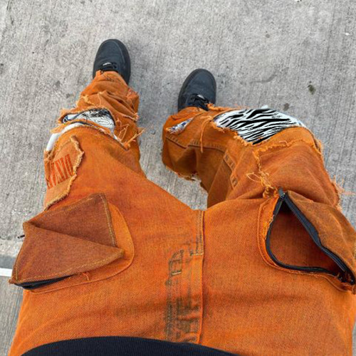 Jeans patchwork orange délavés en gros - Premier fabricant de denim | DiZNEW