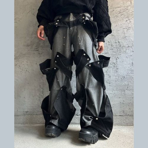 Maßgeschneiderte Avantgarde-Patchwork-Jeans in Schwarz und Grau mit Druckknöpfen - DiZNEW Denim