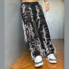 Shredded Black Denim Jeans with White Yarn Detailing - Distressed Streetwear for Men