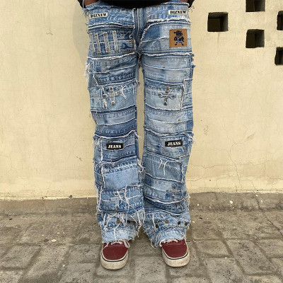 Jean patchwork en denim vieilli DiZNEW avec couches effilochées pour streetwear personnalisable