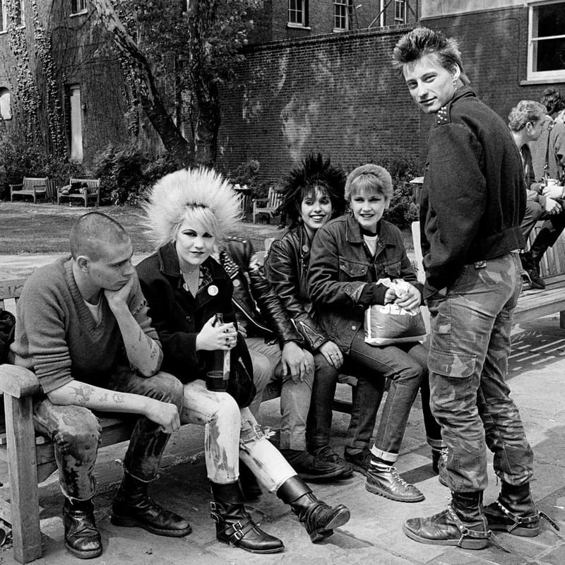 Which subcultures and social movements embraced ripped jeans, what do they symbolize, and why have they been criticized?