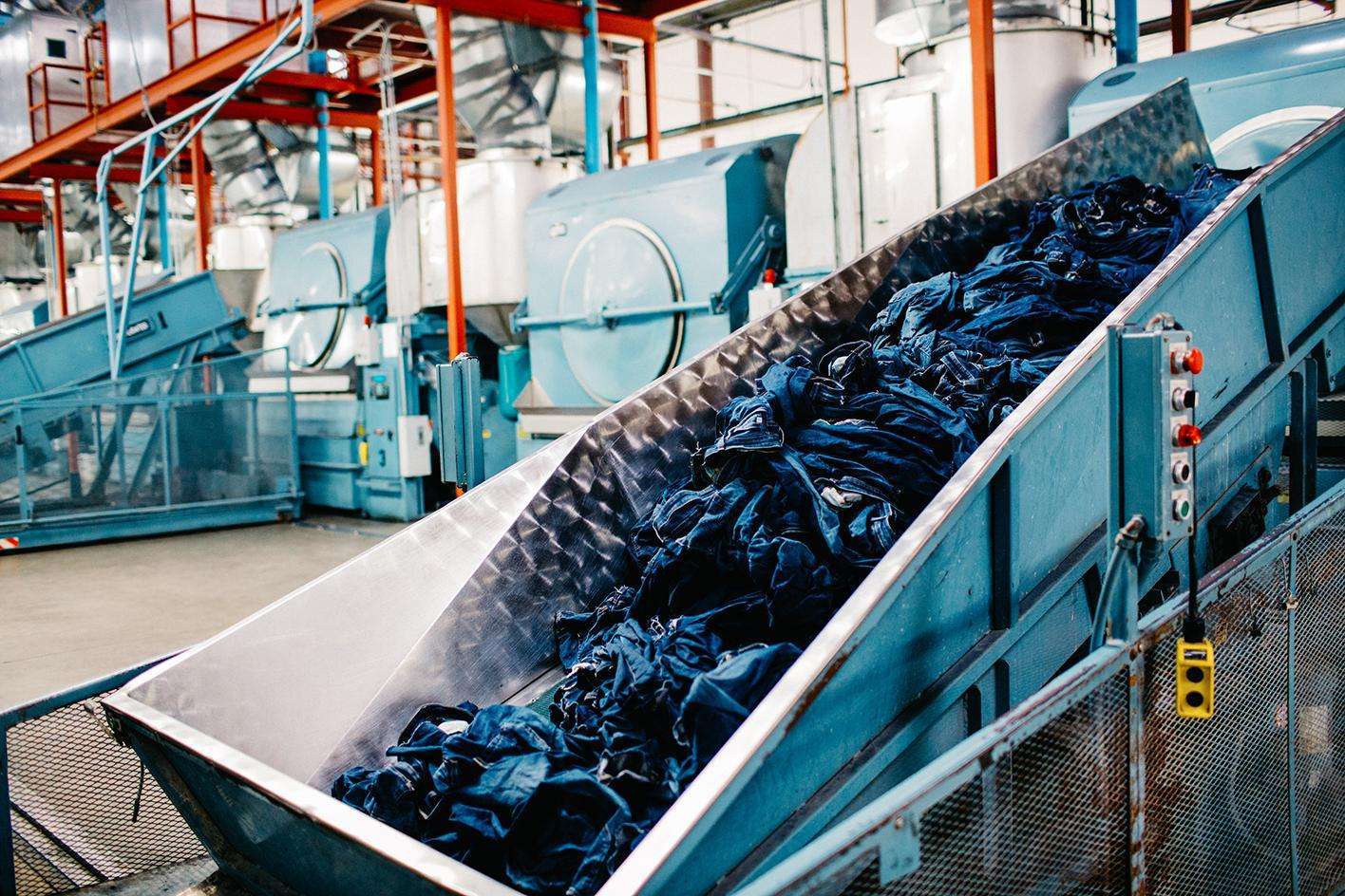How do leading brands reduce water, energy and chemical use in their denim production?
