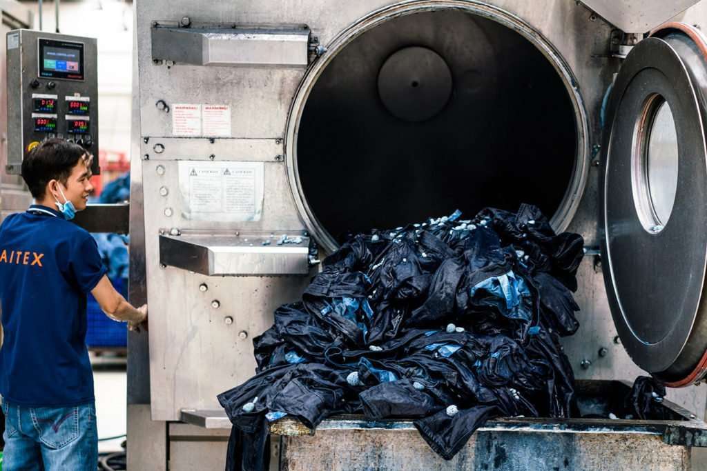 What chemicals do factories use to acid-wash jeans?
