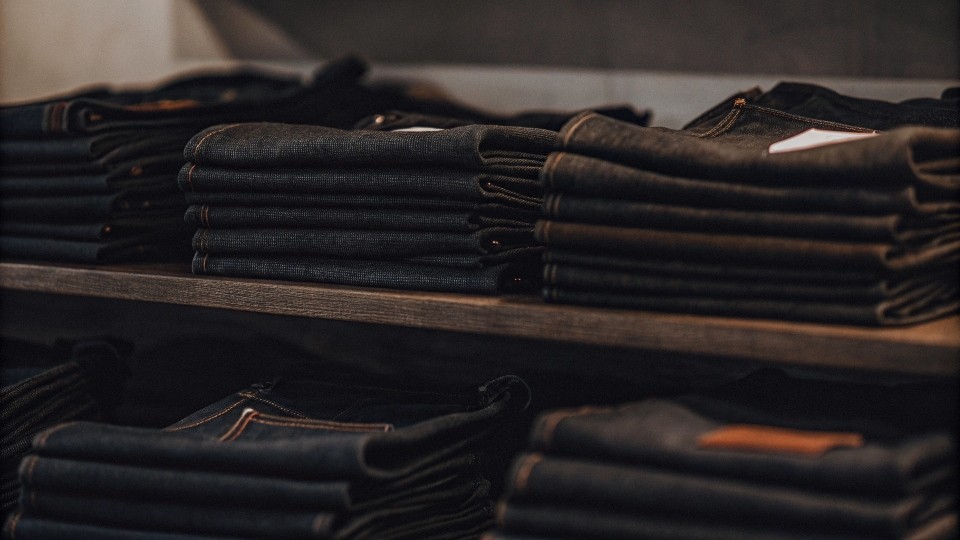 A display of jeans from various top brands like Levi's, Nudie, and a Japanese brand.