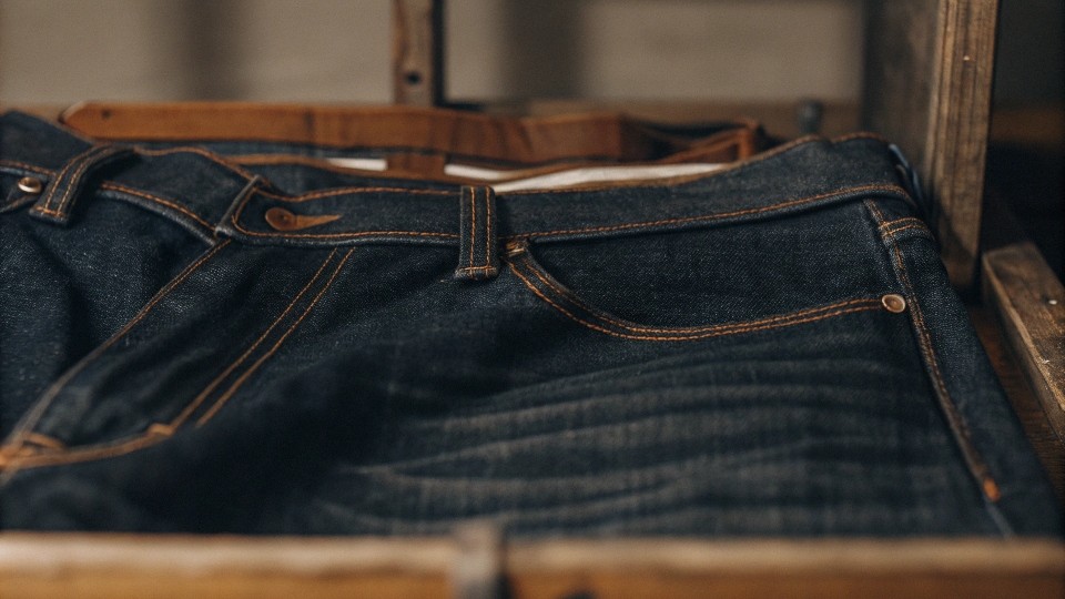 Denim stands out from other cotton fabrics due to its indigo dye, twill weave, and rugged texture. These traits give it a distinct look, feel, and ability to age beautifully with wear.