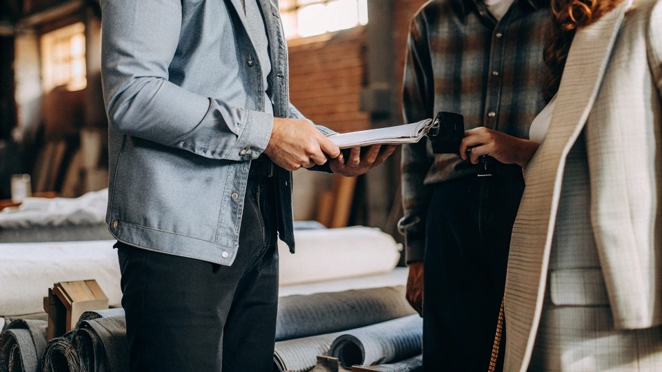Evaluate capabilities by requesting samples, reviewing past client work, confirming fabric sourcing options, and understanding the quality control process. On-site or virtual factory audits help ensure they can handle your production volume and detail needs.