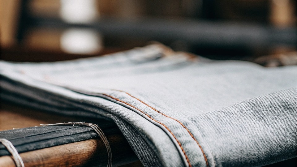 Selvedge denim costs more due to slower production methods, vintage looms, and higher-quality cotton, but the extended durability and aesthetic appeal make it a smart long-term investment.