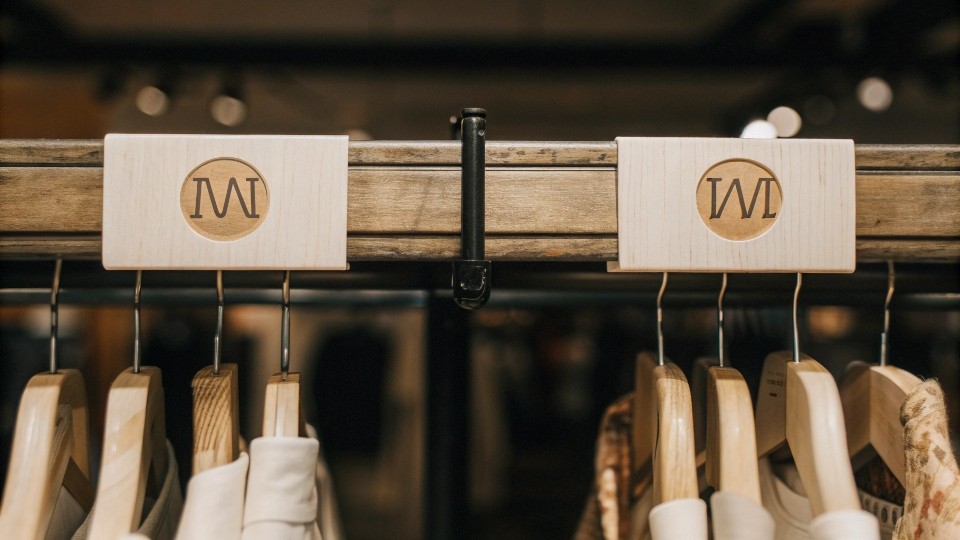 Care tags, size labels, and branding touches often note intended gender—look for “M” or “W