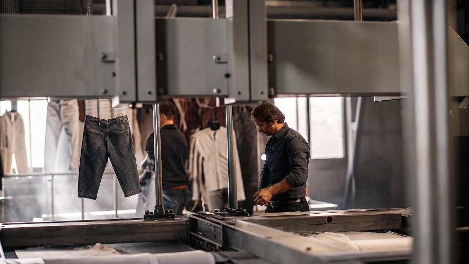 Silver Jeans maintains quality through rigorous mill partnerships, on-site inspections, and eco-friendly wash technologies