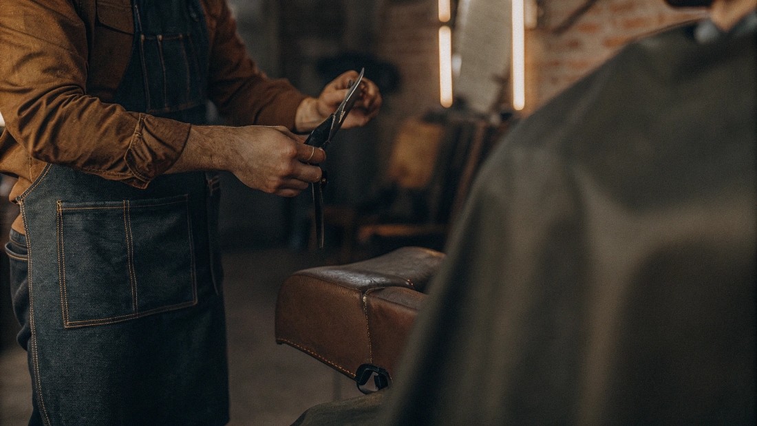 Authentic-looking rips and frays come from combining abrasion (sandpaper or pumice), controlled slits with a razor blade, scissor point cuts