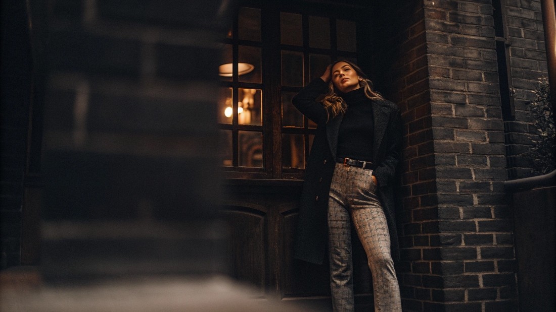 Pair patterned jeans by anchoring the look with neutral or solid-colored tops—white tees, black turtlenecks, muted knits.