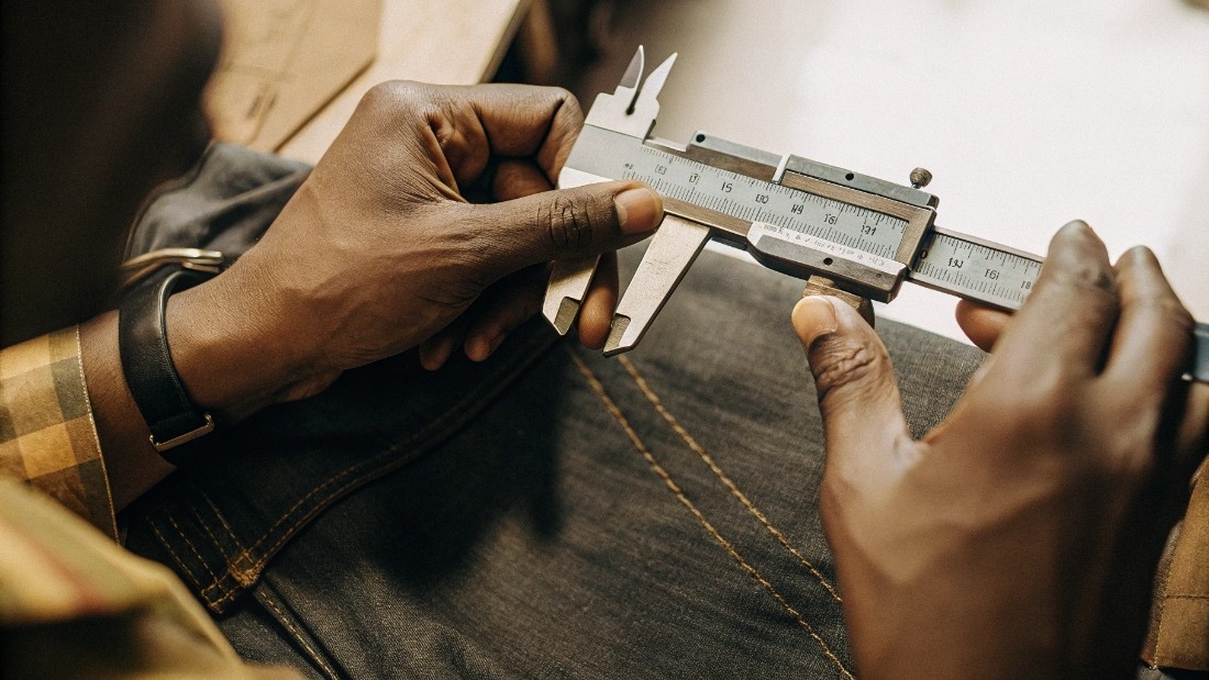 We follow strict industry-standard tolerances, typically +/- 1 cm for major measurements like waist and inseam