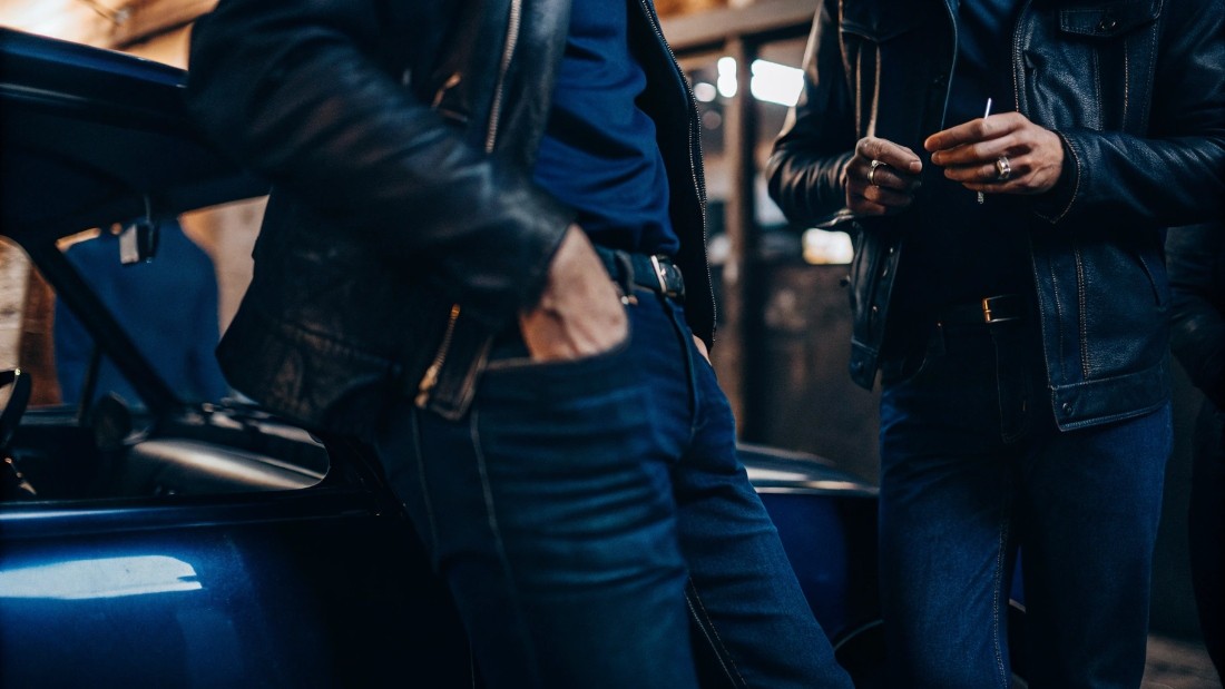 Film stars like James Dean and Marilyn Monroe, rock icons from Elvis to the Ramones, and advertising campaigns all elevated blue jeans from workwear to a symbol of youth and rebellion. 