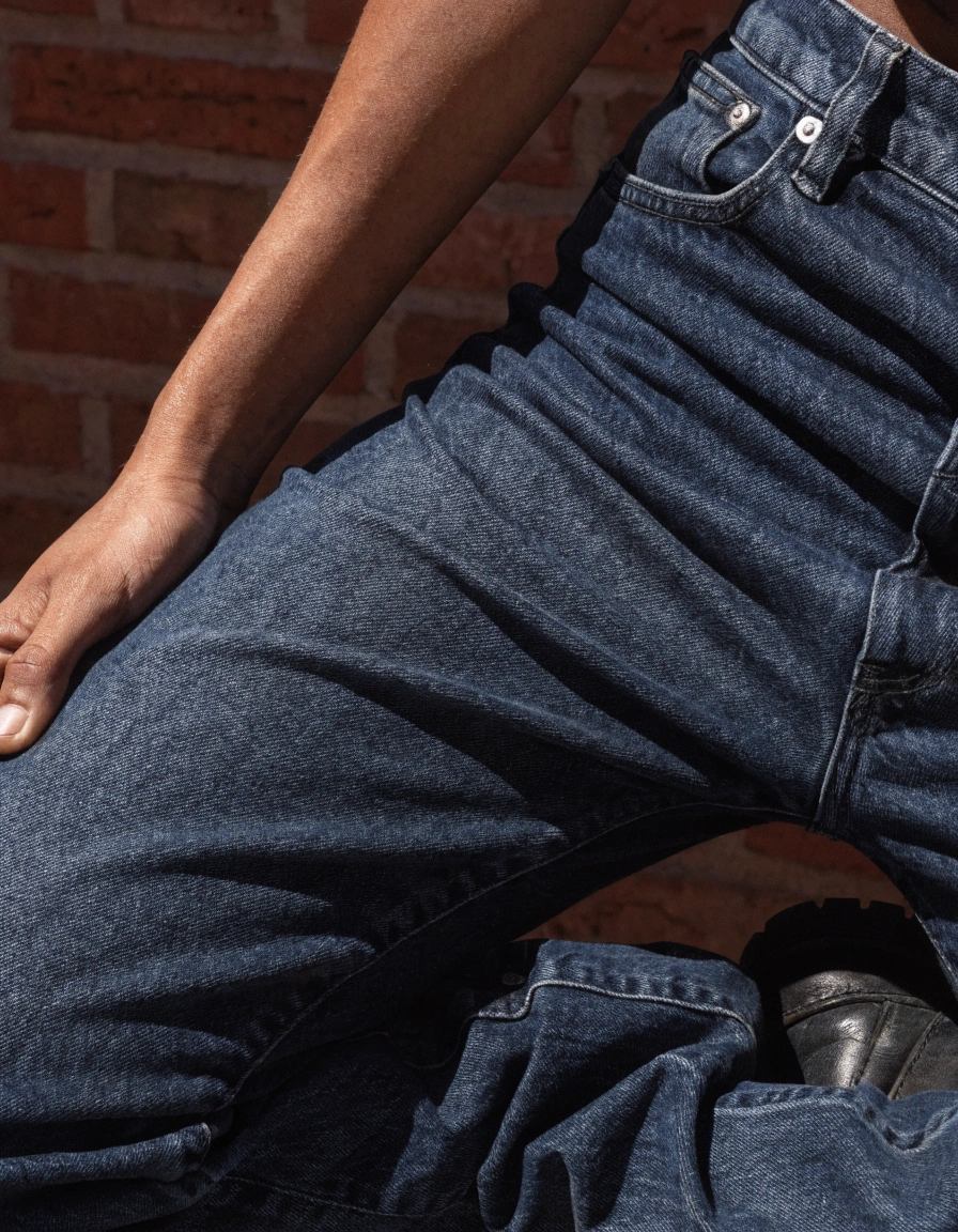Jeans often feel uncomfortable because traditional denim is a dense, rigid cotton twill that restricts movement. Tight waistbands, heavy fabric, and poorly engineered patterns can create pressure points around hips, crotch, and thighs. Even stylish fits like skinny jeans or low rises can feel restrictive when the fabric doesn’t stretch or contour to the body.