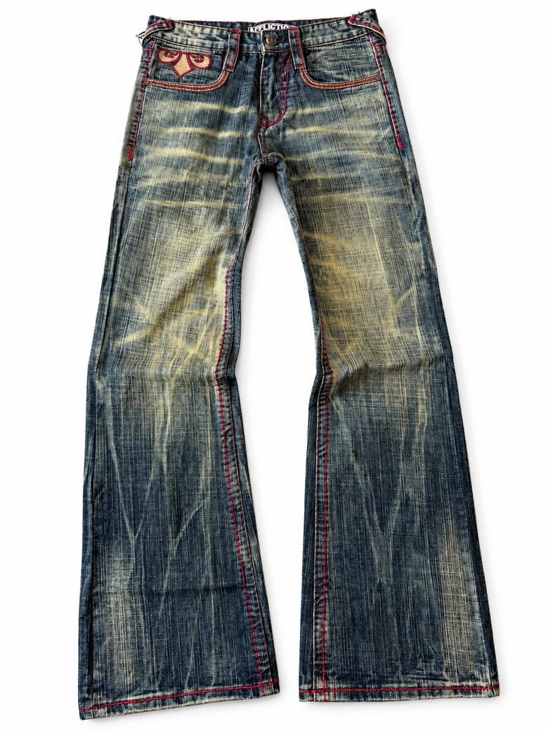 Vintage-wash indigo flared jeans with yellow fading, red contrast stitching and a decorative pocket motif.