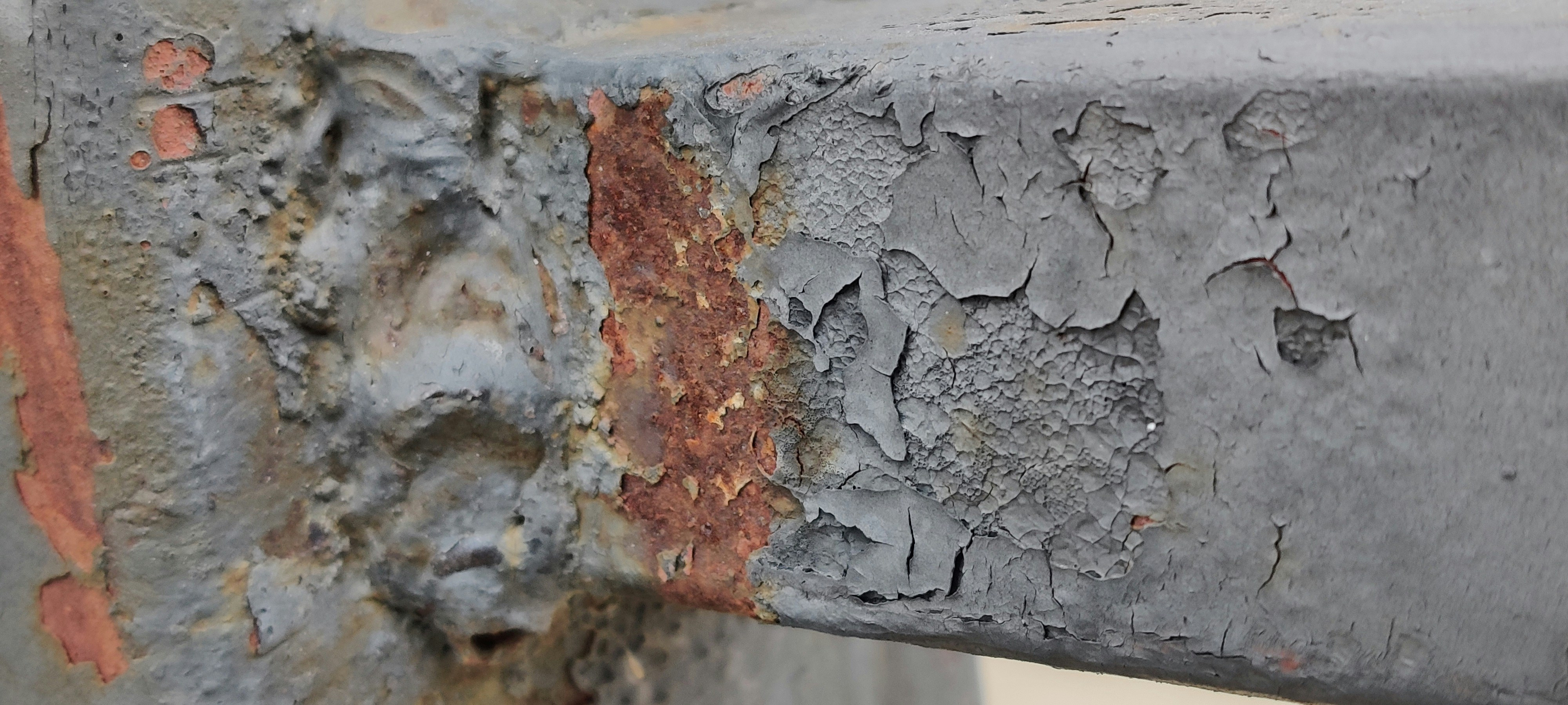 A side-by-side comparison image showing a rough, burred metal edge before and a smooth, radiused edge after being treated with an abrasive filament brush.
