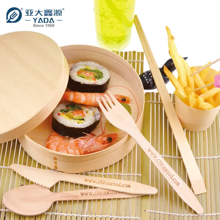 Burger meal served with a wooden knife, fork and spoon set