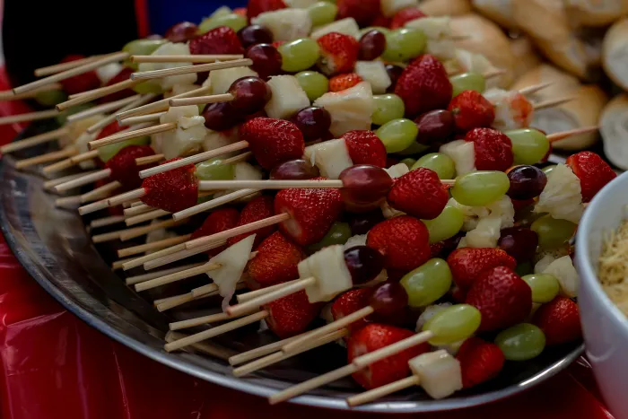 Outdoor catering table with wooden cutlery and bamboo skewers