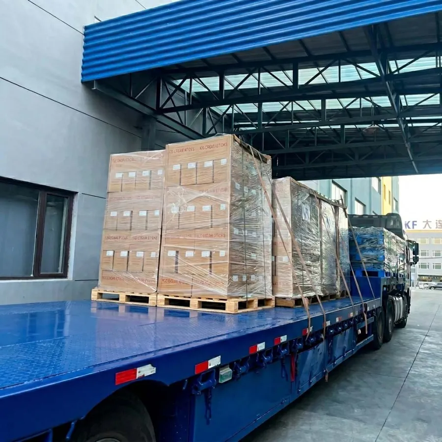 Palletized cartons of finished YADA wooden tableware being loaded for transport at the factory
