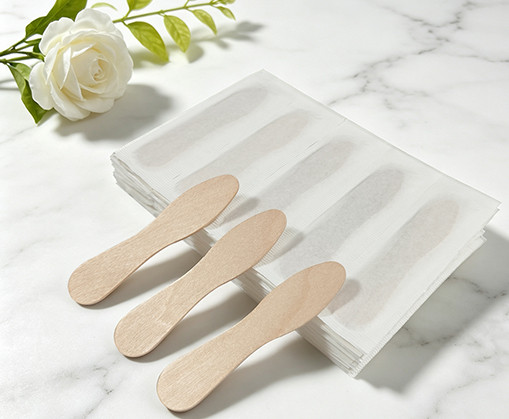 Wooden bow tie ice cream spoons used for gelato and dessert sampling