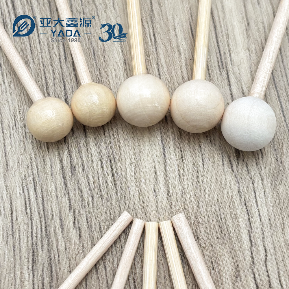 Round ball head turned true to the birch shaft on a wooden candy stick