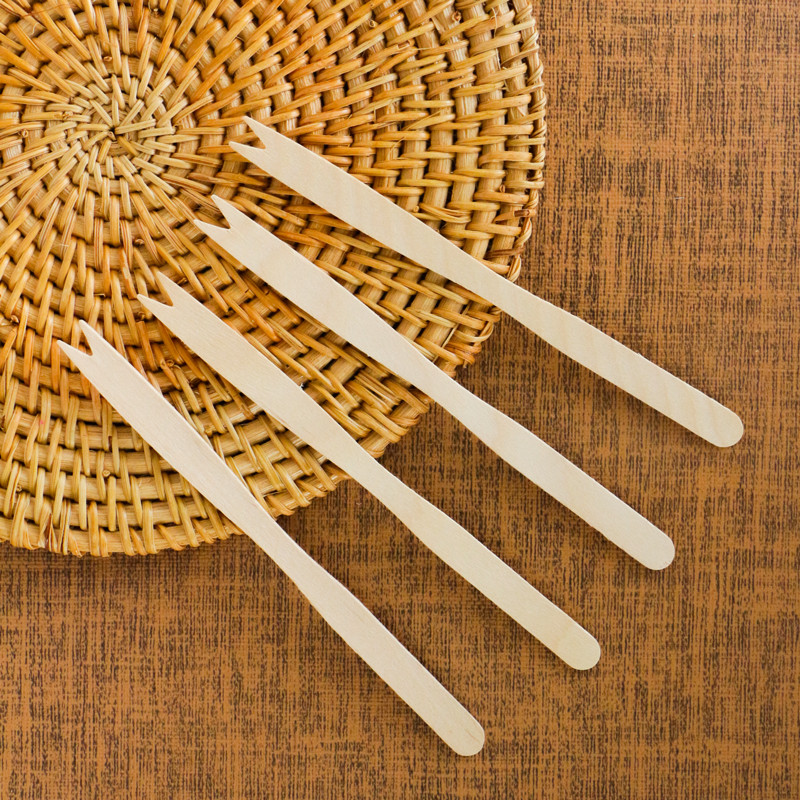 Compact disposable wooden fruit forks for tasting events