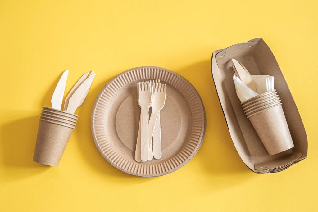 Eco-friendly wooden bowl and tableware on a table