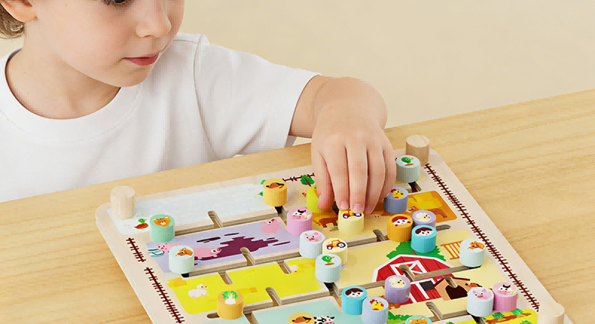 Child playing a wooden farm maze board game