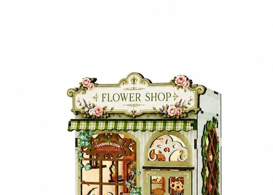 Close-up of engraved floral detail on a wooden flower shop model