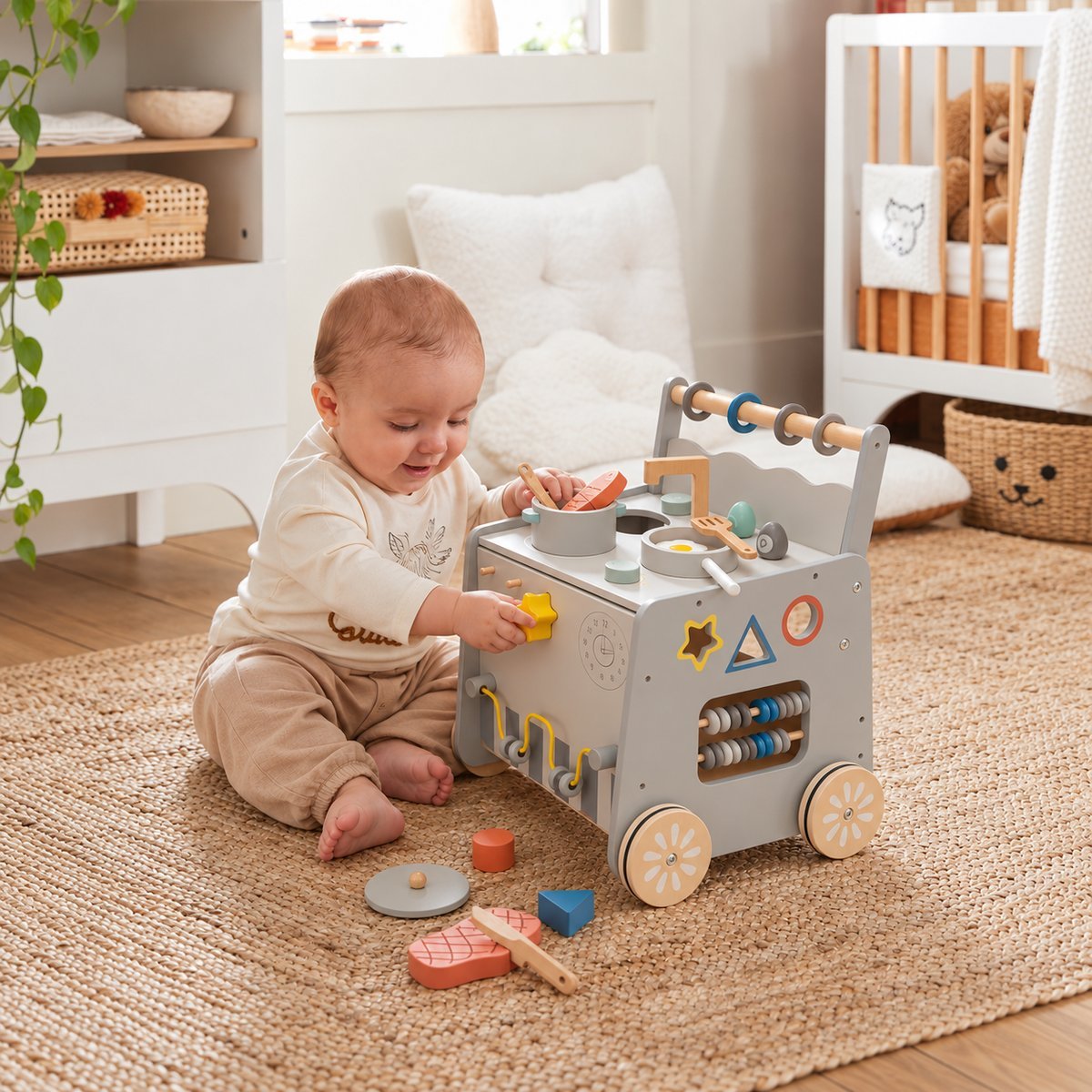 Toddler playing with wooden activity walker kitchen in a bright nursery