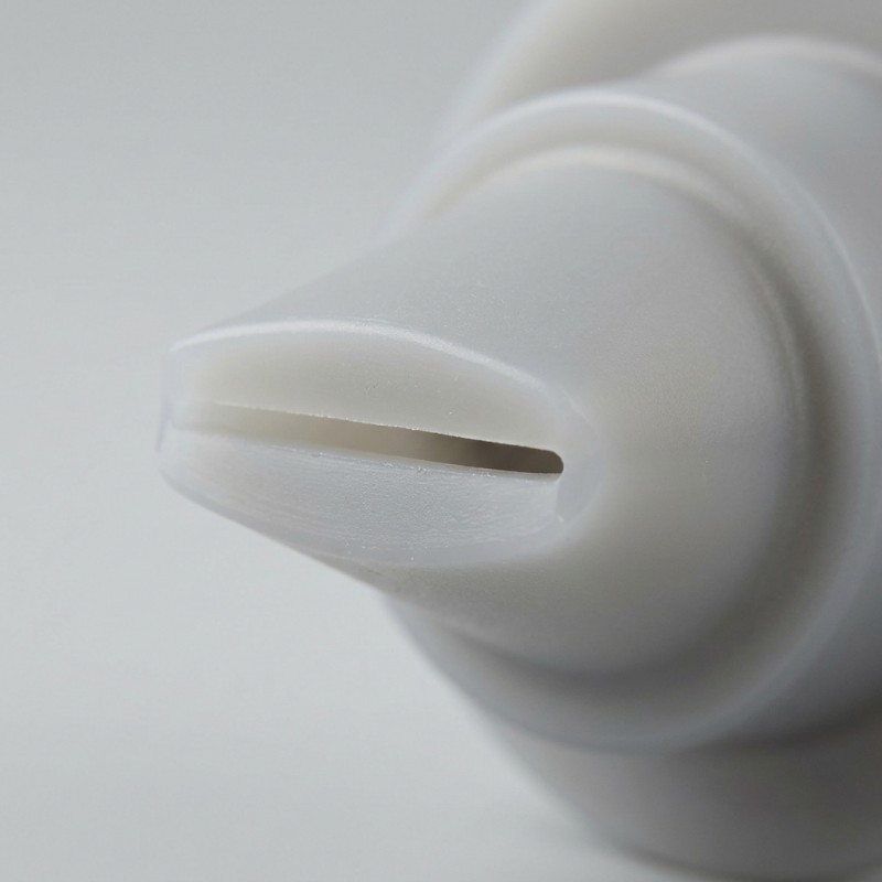 Close-up of the flexible lips and outlet slit on an LSR silicone duckbill valve