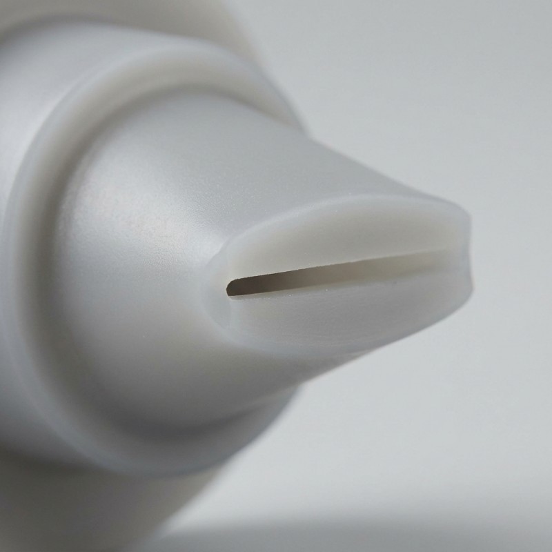 Detailed view of the outlet slit and opposing lip contact surfaces on a silicone duckbill valve