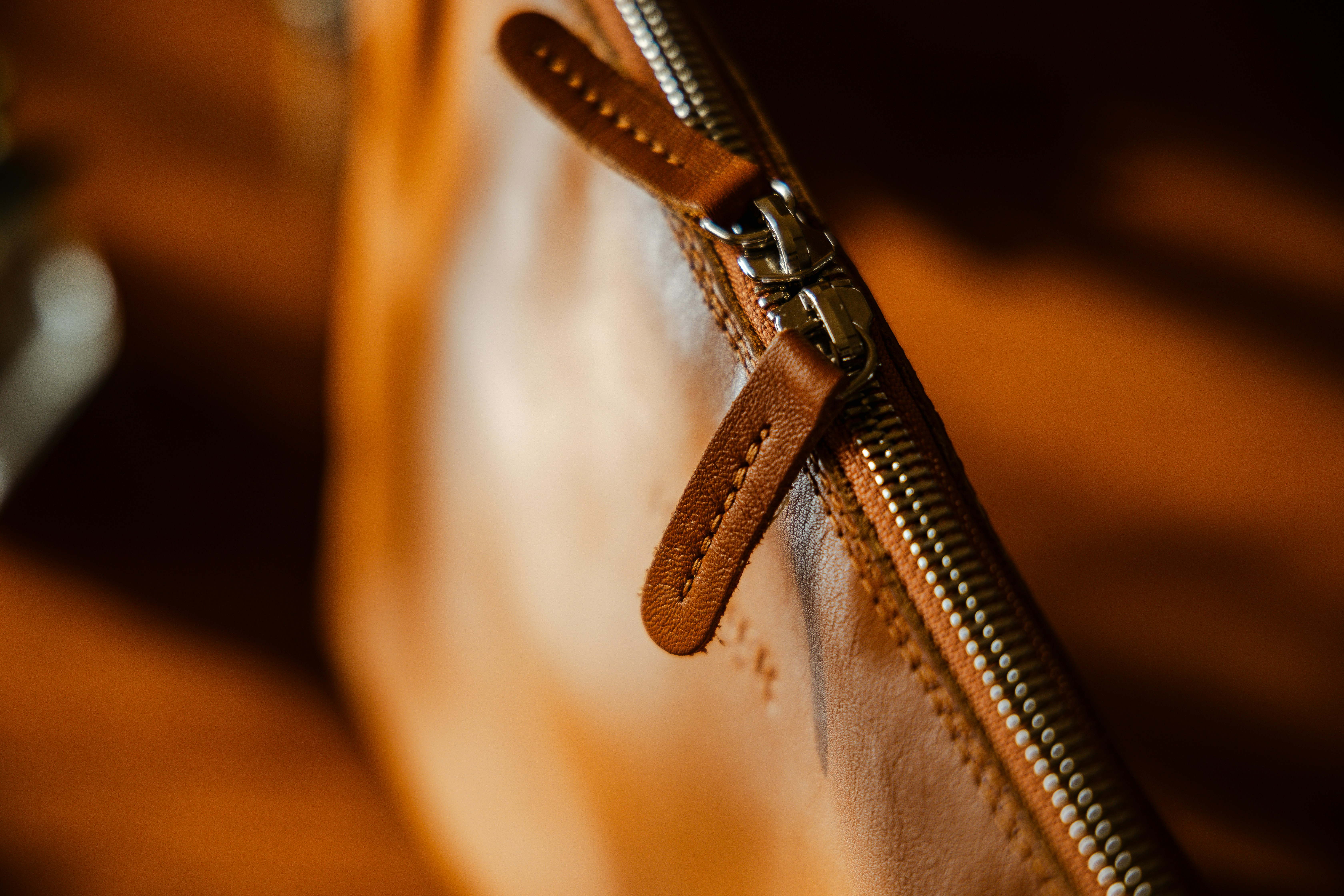 A close-up of different technical fabric swatches for horse riding pants