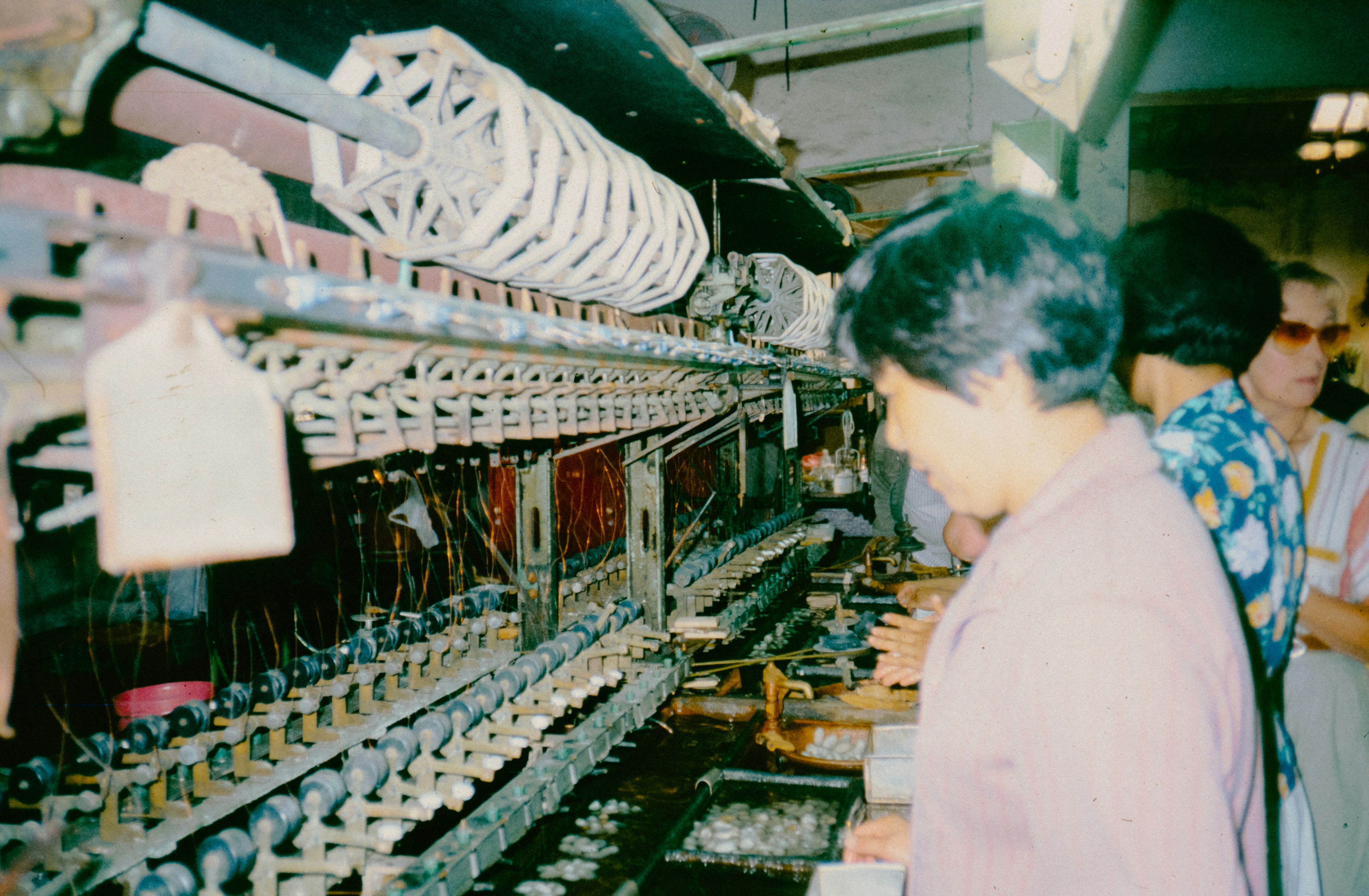 Quality control inspection of activewear Image of quality control inspectors examining sportswear garments on a production line